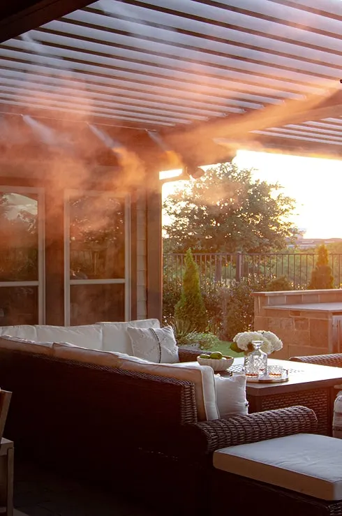 High pressure misting system cooling a backyard patio