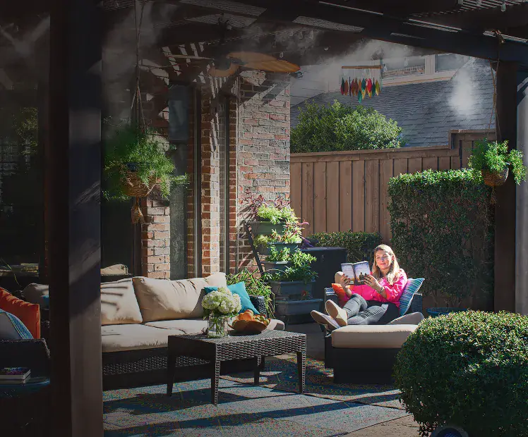Patio misters cooling an outdoor seating area